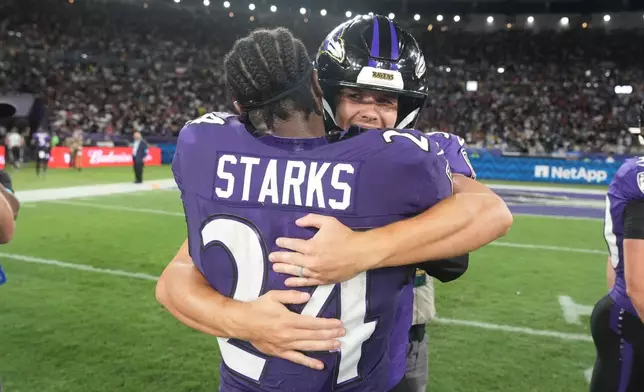 Baltimore Ravens place kicker Tyler Loop (33) celebrates with safety Malaki Starks (24) after winning an NFL football game against the Dallas Cowboys in Rio de Janeiro, Sunday, Sept. 27, 2026. (AP Photo/Fernando Llano)
