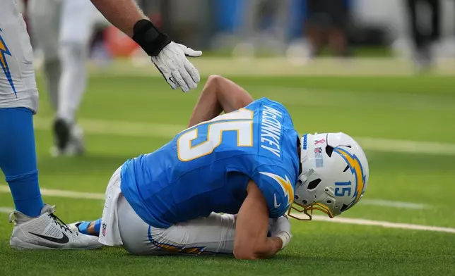 Los Angeles Chargers wide receiver Ladd McConkey is slow to get up after an injury during the second half of an NFL football game against the Arizona Cardinals Sunday, Sept. 13, 2026, in Inglewood, Calif. (AP Photo/Gregory Bull)