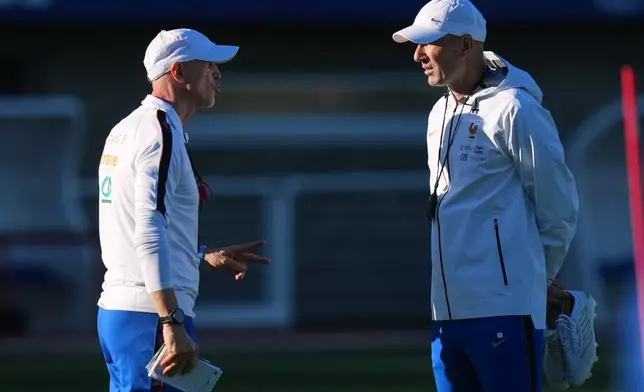 France national soccer team coach Zinedine Zidane, right, and assistant coach David Bettoni, left, chat during a training session in Clairefontaine-en-Yvelines west of Paris, Tuesday, Sept. 22, 2026, three days ahead of France's UEFA Nations League soccer match against Turkey. (AP Photo/Thibault Camus)