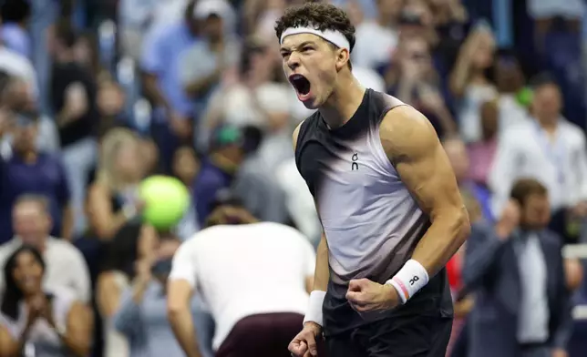 Ben Shelton, of the United States, celebrates winning a match against Stefanos Tsitsipas, of Greece, during the fourth round of the U.S. Open tennis championships, Sunday, Sept. 6, 2026, in New York. (AP Photo/Adam Hunger)