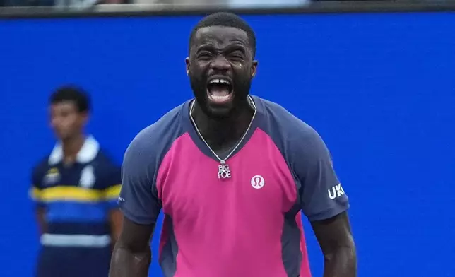 Frances Tiafoe, of the United States, celebrates winning a match against Daniil Medvedev, of Russia, during the fourth round of the U.S. Open tennis championships, Sunday, Sept. 6, 2026, in New York. (AP Photo/Frank Franklin II)