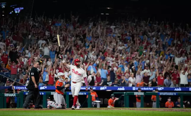 Philadelphia Phillies' Kyle Schwarber celebrates after hitting a grand slam against Houston Astros pitcher AJ Blubaugh during the sixth inning of a baseball game Wednesday, Sept. 9, 2026, in Philadelphia. (AP Photo/Matt Slocum)
