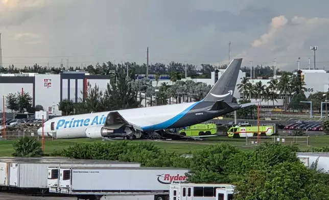 An Amazon cargo plane sits at the Miami International Airport (MIA) after it overshot the runway, Sunday, Sept. 6, 2026. (AP Photo/David Fischer)