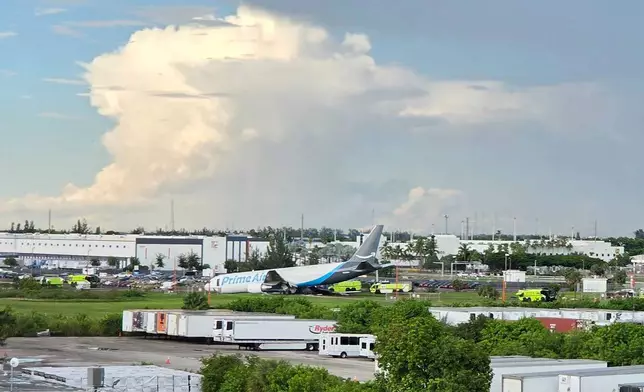 An Amazon cargo plane sits at the Miami International Airport (MIA) after it overshot the runway, Sunday, Sept. 6, 2026. (AP Photo/David Fischer)