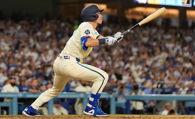 Los Angeles Dodgers' Tommy Edman heads to first for a three-run home run during the seventh inning of a baseball game against the Washington Nationals, Saturday, Sept. 5, 2026, in Los Angeles. (AP Photo/Mark J. Terrill)