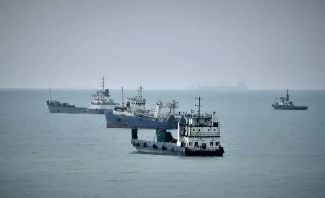 Commercial vessels lie anchored in the Strait of Hormuz off Bandar Abbas, Iran, Friday, Sept. 4, 2026. (AP Photo/Vahid Salemi)