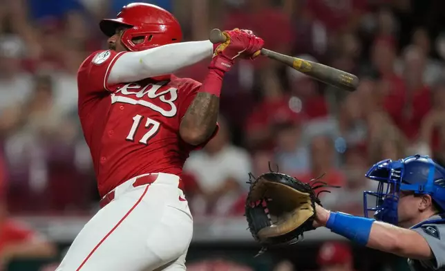 Cincinnati Reds' Dane Myers, left, watches his solo home run as Los Angeles Dodgers catcher Will Smith is at right, during the fifth inning of a baseball game, Wednesday, Sept. 16, 2026, in Cincinnati. (AP Photo/Carolyn Kaster)