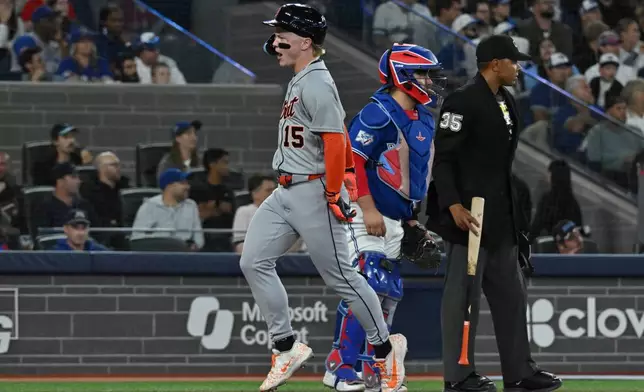 Detroit Tigers' Max Clark (15) scores on a double by Detroit Tigers' Spencer Torkelson during the seventh inning of a baseball game in Toronto on Monday, Sept. 14, 2026. (Jon Blacker/The Canadian Press via AP)
