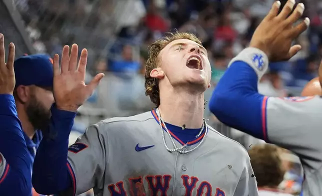 New York Mets' Carson Benge celebrates after scoring on a double hit by Marcus Semien during the sixth inning of a baseball game against the Miami Marlins, Monday, Sept. 7, 2026, in Miami. (AP Photo/Lynne Sladky)