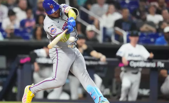 New York Mets' Francisco Alvarez hits a RBI single to score Marcus Semien during the third inning of a baseball game against the Miami Marlins, Monday, Sept. 7, 2026, in Miami. (AP Photo/Lynne Sladky)