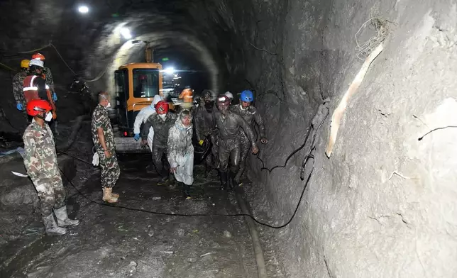 In this handout photograph provided by the Nepal Army, Nepalese soldiers undertake a search and rescue operation at the Chilime hydropower project following earlier flash floods in Nepal's Rasuwa district, Wednesday, Sept. 16, 2026. (Nepal Army via AP)