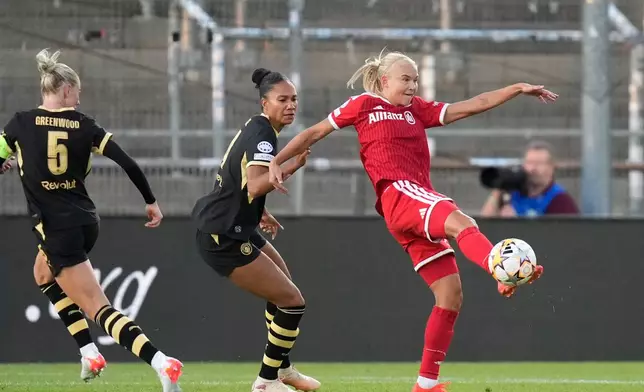 Bayern's Pernille Harder kicks the ball next to Manchester City's Jade Rose during the women's Champions League opening phase soccer match between FC Bayern Munich and Manchester City in Munich, Germany, Tuesday, Sept. 22, 2026. (AP Photo/Matthias Schrader)