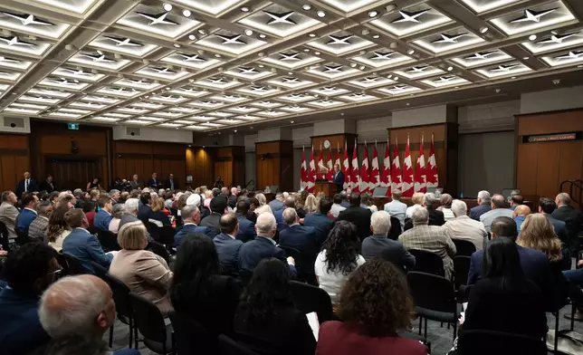 Prime Minister Mark Carney addresses caucus in Ottawa, Friday, Sept. 18, 2026. (Adrian Wyld/The Canadian Press via AP)