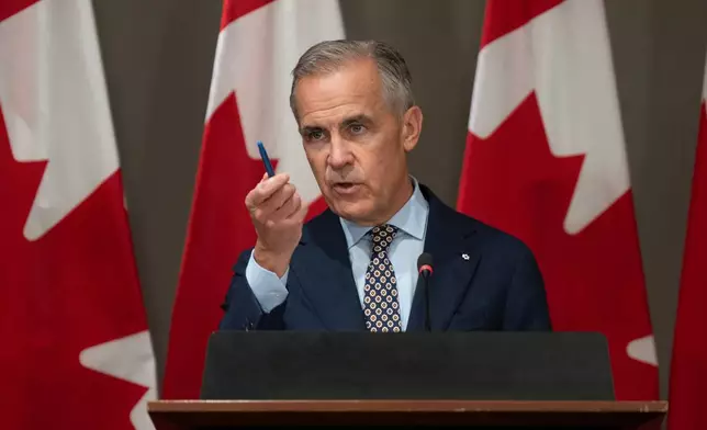 Prime Minister Mark Carney addresses caucus in Ottawa, Friday, Sept. 18, 2026. (Adrian Wyld/The Canadian Press via AP)