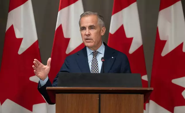 Prime Minister Mark Carney addresses caucus in Ottawa, Friday, Sept. 18, 2026. (Adrian Wyld/The Canadian Press via AP)