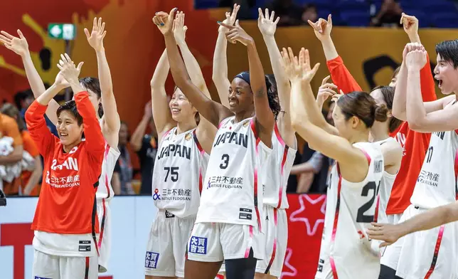 The Japanese team acknowledges fans after the women's World Cup basketball match between Mali and Japan, in Berlin Friday, Sept. 4, 2026. (Andreas Gora/dpa via AP)