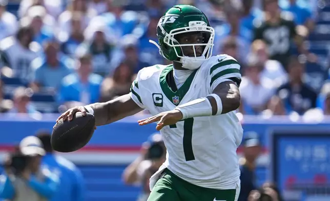 New York Jets quarterback Geno Smith (7) looks to pass during the second half of an NFL football game against the Tennessee Titans, Sunday, Sept. 13, 2026, in Nashville, Tenn. (AP Photo/John Amis)