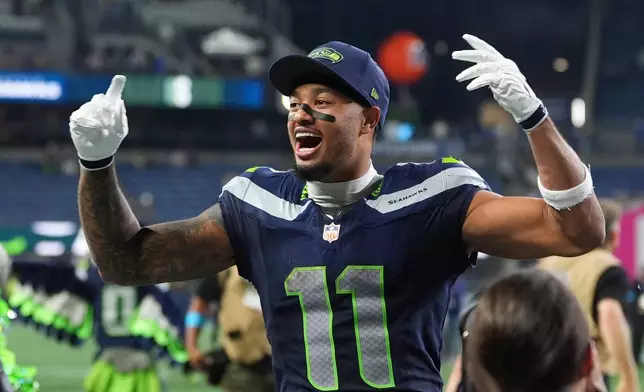 Seattle Seahawks wide receiver Jaxon Smith-Njigba speaks celebrates after winning an NFL football game against the New England Patriots, Wednesday, Sept. 9, 2026, in Seattle. (AP Photo/Lindsey Wasson)