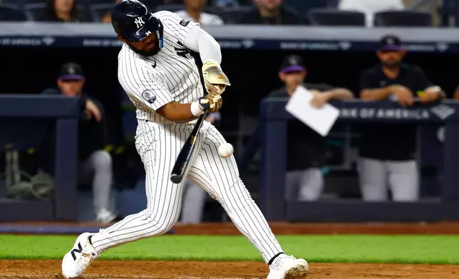 New York Yankees' Heliot Ramos hits a three run home run against the Colorado Rockies during the eighth inning of a baseball game, Tuesday, Sept. 8, 2026, in New York. (AP Photo/Noah K. Murray)
