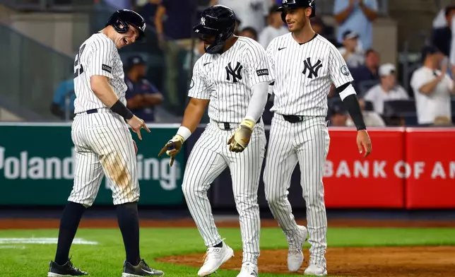 New York Yankees' Ben Rice, left and Heliot Ramos, right , celebrate after Ramos three-run home run during the eighth inning of a baseball game against theColorado Rockies , Tuesday, Sept. 8, 2026, in New York. (AP Photo/Noah K. Murray)