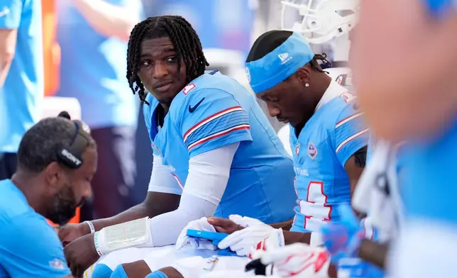 Tennessee Titans quarterback Cam Ward (1) reacts on the bench during the second half of an NFL football game against the New York Jets, Sunday, Sept. 13, 2026, in Nashville, Tenn. (AP Photo/George Walker IV)