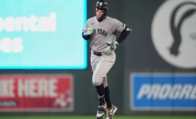 New York Yankees' Aaron Judge runs the bases after hitting a three-run home run during the eighth inning of a baseball game against the Minnesota Twins, Monday, Sept. 14, 2026, in Minneapolis. (AP Photo/Abbie Parr)