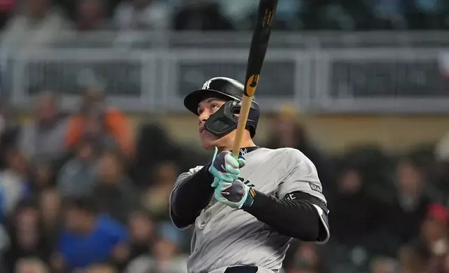New York Yankees' Aaron Judge watches his three-run home run during the eighth inning of a baseball game against the Minnesota Twins, Monday, Sept. 14, 2026, in Minneapolis. (AP Photo/Abbie Parr)