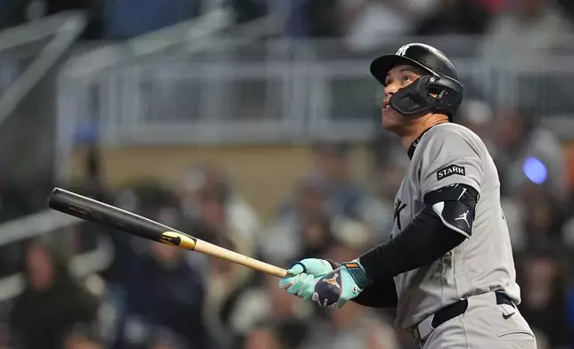 New York Yankees' Aaron Judge watches his three-run home run during the eighth inning of a baseball game against the Minnesota Twins, Monday, Sept. 14, 2026, in Minneapolis. (AP Photo/Abbie Parr)