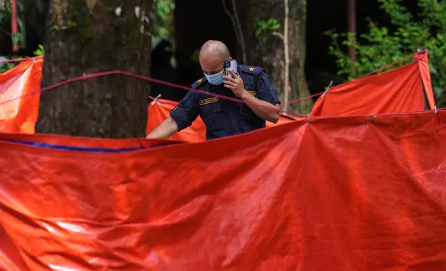 A Nepalese military officer counts bodies recovered in the aftermath of flash floods in Nepal's Nuwakot district, Wednesday, Sept. 2, 2026. (AP Photo/Rajesh Kumar Singh)