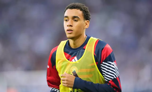 Bayern's Jamal Musiala warms up during the German Bundesliga soccer match between FC Schalke 04 and Bayern Munich in Gelsenkirchen, Germany, Saturday, Sept. 5, 2026. (AP Photo/Martin Meissner)