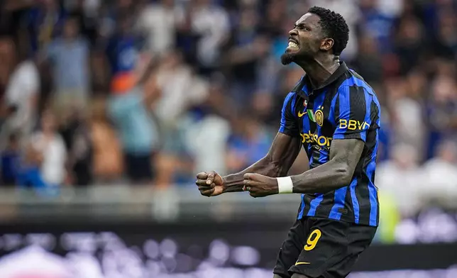 Inter's Marcus Thuram celebrates after scoring his team's second goal during the Serie A soccer match between Inter and Napoli at the San Siro Stadium in Milan, Italy, Saturday, Sept. 5, 2026. (Marco Alpozzi/LaPresse via AP)