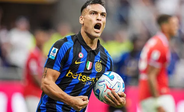 Inter's Lautaro Martinez celebrates after scoring his team's first goal during the Serie A soccer match between Inter and Napoli at the San Siro Stadium in Milan, Italy, Saturday, Sept. 5, 2026. (Marco Alpozzi/LaPresse via AP)