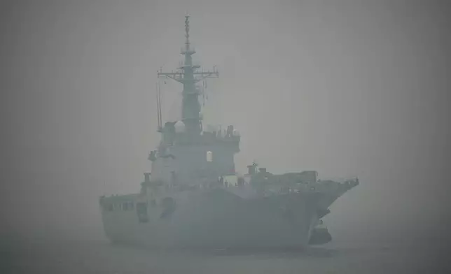 Japanese tank landing ship JS Kunisaki approaches Kijing Port amid the thick haze from forest fires in Mempawah, West Kalimantan, Indonesia, Thursday, Sept. 10, 2026. (AP Photo/Tatan Syuflana)