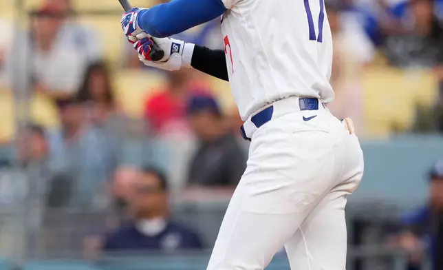 Los Angeles Dodgers' Shohei Ohtani flies out during the first inning of a baseball game against the Cincinnati Reds, Monday, Sept. 7, 2026, in Los Angeles. (AP Photo/Mark J. Terrill)