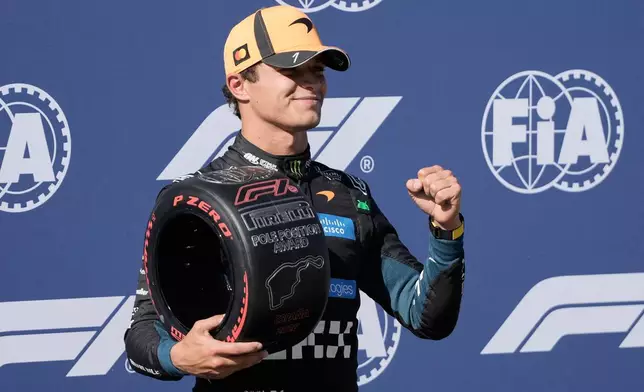 McLaren driver Lando Norris of Britain celebrates his pole position after the qualifying session for the Spanish Formula One Grand Prix in Madrid, Saturday, Sept. 12, 2026. (AP Photo/Bernat Armangue)