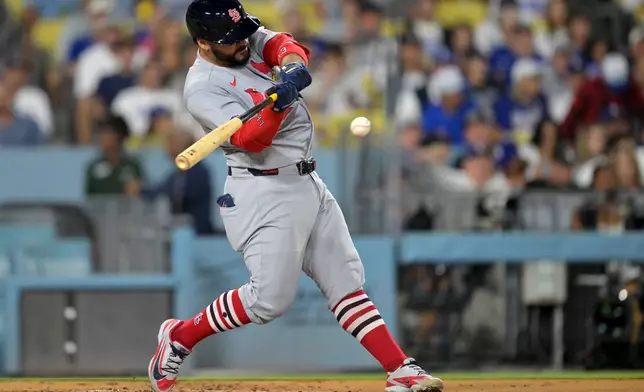 St. Louis Cardinals' Leo Bernal hits a RBI double for his first major league hit during the third inning of a baseball game against the Los Angeles Dodgers, Tuesday, Sept. 1, 2026, in Los Angeles. (AP Photo/Jayne Kamin-Oncea)