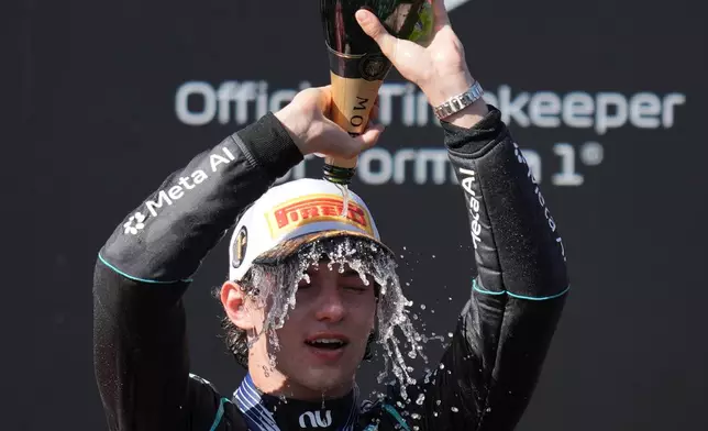 Mercedes driver Andrea Kimi Antonelli of Italy celebrates on the podium after winning the Spanish Formula One Grand Prix race in Madrid, Sunday, Sept. 13, 2026. (AP Photo/Bernat Armangue)