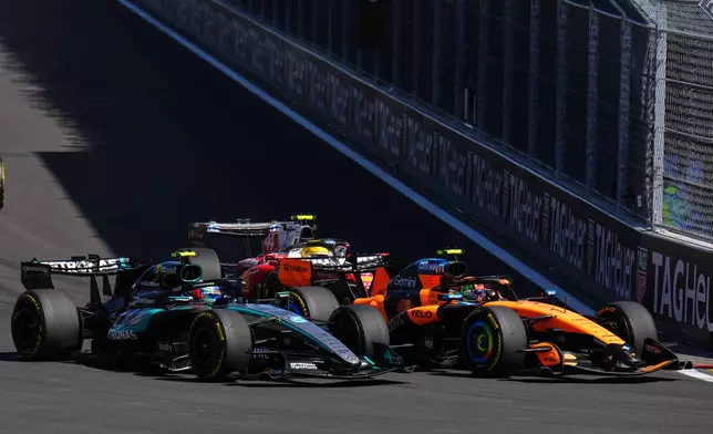 McLaren driver Lando Norris of Britain, right, and Mercedes driver Andrea Kimi Antonelli of Italy steer their cars during the Spanish Formula One Grand Prix race in Madrid, Sunday, Sept. 13, 2026. (AP Photo/Manu Fernandez)