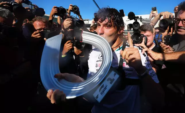 Mercedes driver Andrea Kimi Antonelli of Italy celebrates with his team after winning the Spanish Formula One Grand Prix race in Madrid, Sunday, Sept. 13, 2026. (AP Photo/Manu Fernandez)