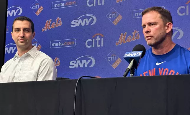 Andy Green, right, responds to question during a news conference where he was introduced as the New York Mets new manager as President of Baseball Operations David Stearns, left, looks on before a baseball game against the Texas Rangers Tuesday, Sept. 22, 2026, in Arlington, Texas. (AP Photo/Stephen Hawkins)