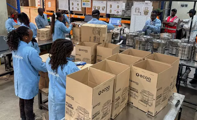Workers assemble fuel-efficient cookstoves at BURN, a manufacturer of clean cooking appliances, in Kiambu, Kenya, on July 31, 2026. (AP Photo/Allan Olingo)