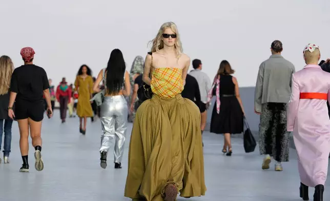 A model wears a creation part of the Moschino women's Spring-Summer 2027 collection, presented in Milan, Italy, Friday, Sept. 25, 2026. (AP Photo/Luca Bruno)