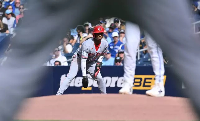 Cincinnati Reds' Carlos Jorge (38) takes a lead off first base against the Toronto Blue Jays during the first inning of a baseball game in Toronto, Saturday, Sept. 26, 2026. (Jon Blacker/The Canadian Press via AP)