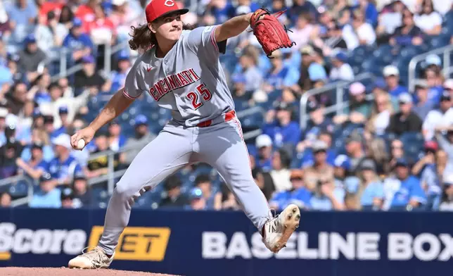 Cincinnati Reds starting pitcher Rhett Lowder (25) throws to a Toronto Blue Jays batter during the first inning of a baseball game in Toronto, Saturday, Sept. 26, 2026. (Jon Blacker/The Canadian Press via AP)