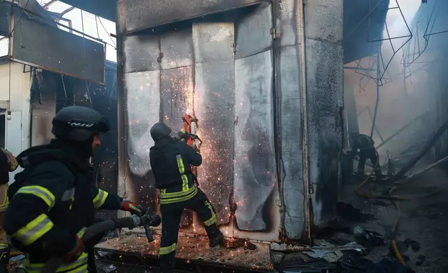 Rescuers work on a site of Russian drone strike on the central market of Zaporizhzhia, Ukraine, on Saturday, Sept. 26, 2026. (AP Photo/Kateryna Klochko)