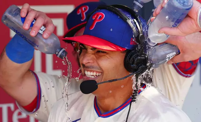 Philadelphia Phillies pitcher Jesús Luzardo is doused by teammates in the dugout after a baseball game against the Atlanta Braves, Monday, Sept. 7, 2026, in Philadelphia. (AP Photo/Derik Hamilton)