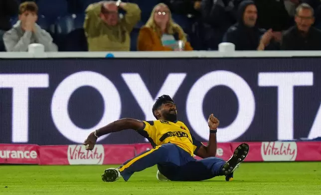 Sri Lanka's Eshan Malinga celebrates taking catch of England's Harry Brook during the second IT20 match between England and Sri Lanka in Cardiff, Wales, Thursday Sept. 17, 2026. (David Davies/PA via AP)