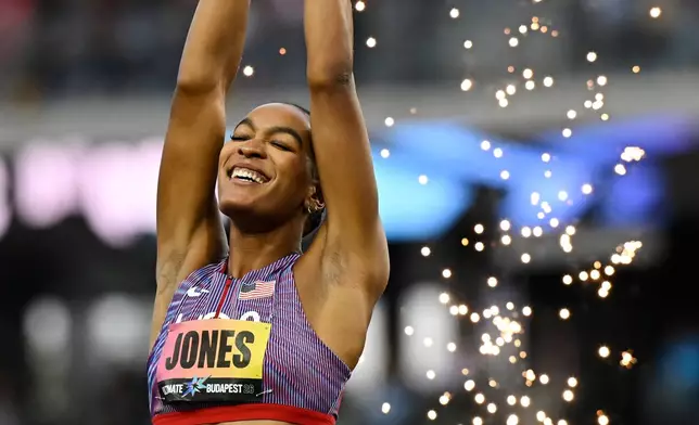 Jasmine Jones, of the United States, celebrates winning the women's 400 meters hurdle final during the World Athletics Ultimate Championship in Budapest, Hungary, Sunday, Sept. 13, 2026. (AP Photo/Denes Erdos)