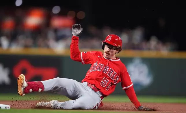 Los Angeles Angels' Wade Meckler slides safely into third base for a triple against the Seattle Mariners during the first inning of a baseball game, Friday, Sept. 25, 2026, in Seattle. (AP Photo/Lindsey Wasson)