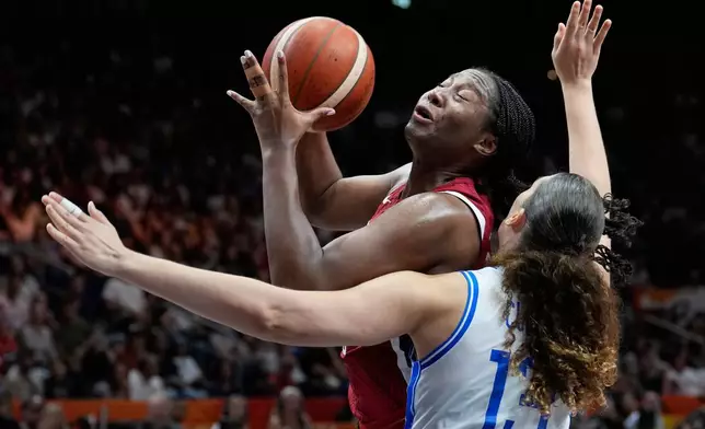 Aliyah Boston, of the United States, shoots over Italy's Lorela Cubaj during the Women's Basketball World Cup match between the United States and Italy in Berlin, Sunday, Sept. 6, 2026. (AP Photo/Ebrahim Noroozi)